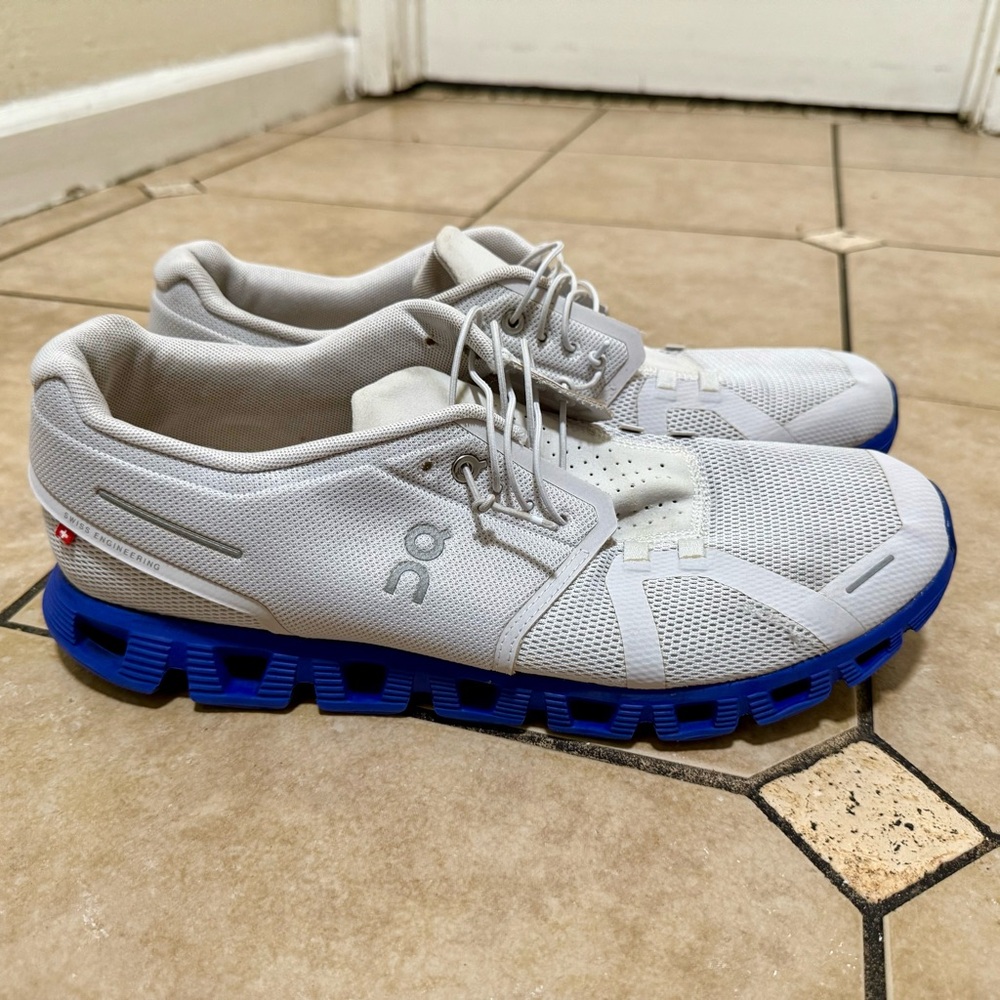 On Running White and Blue Athletic Shoes with CloudTec Cushioning